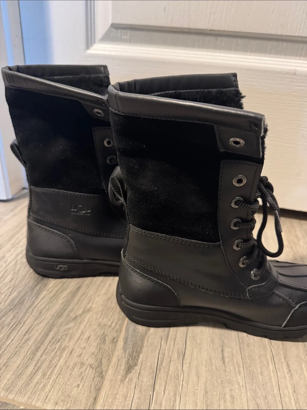 UGG Adirondack water proof insulated lace up winter boots.